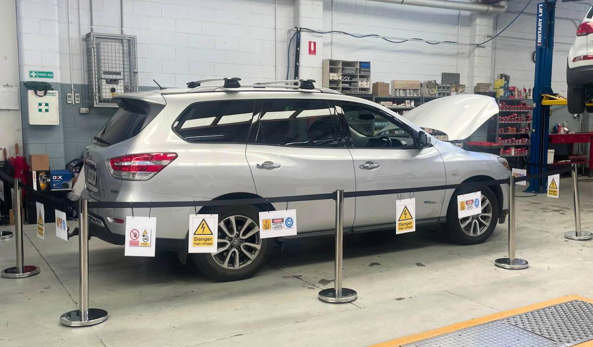 Electric vehicles hold high voltages and need to be worked on in a safe manner.